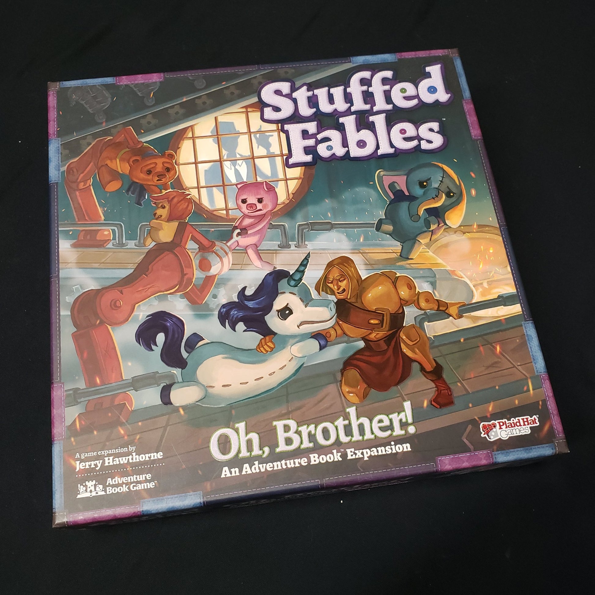 Image shows the front cover of the box of the Oh, Brother! expansion for the board game Stuffed Fables