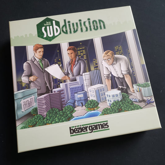 Image shows the front cover of the box of the Subdivision board game