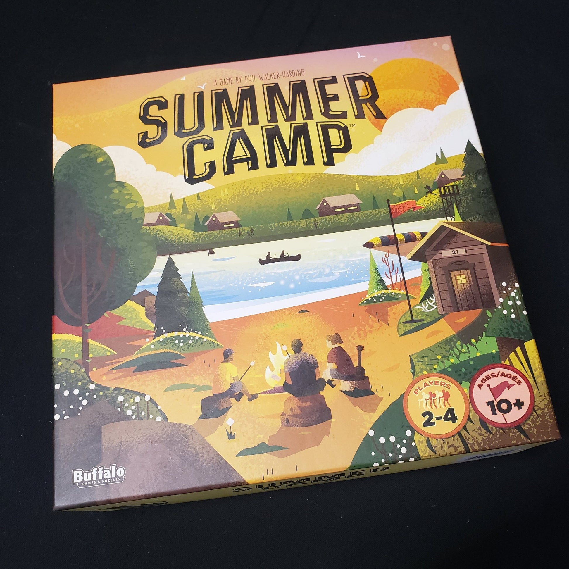 Image shows the front cover of the box of the Summer Camp board game