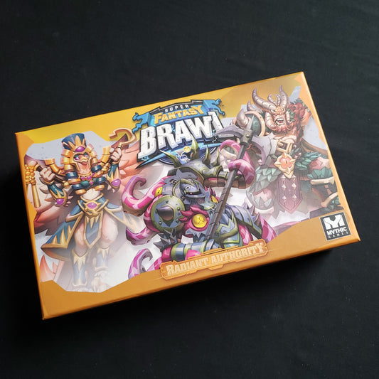 Image shows the front of the box for the Radiant Authority Expansion for the Super Fantasy Brawl board game