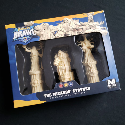Image shows the front of the box for the Wizards' Statues Expansion for the Super Fantasy Brawl board game