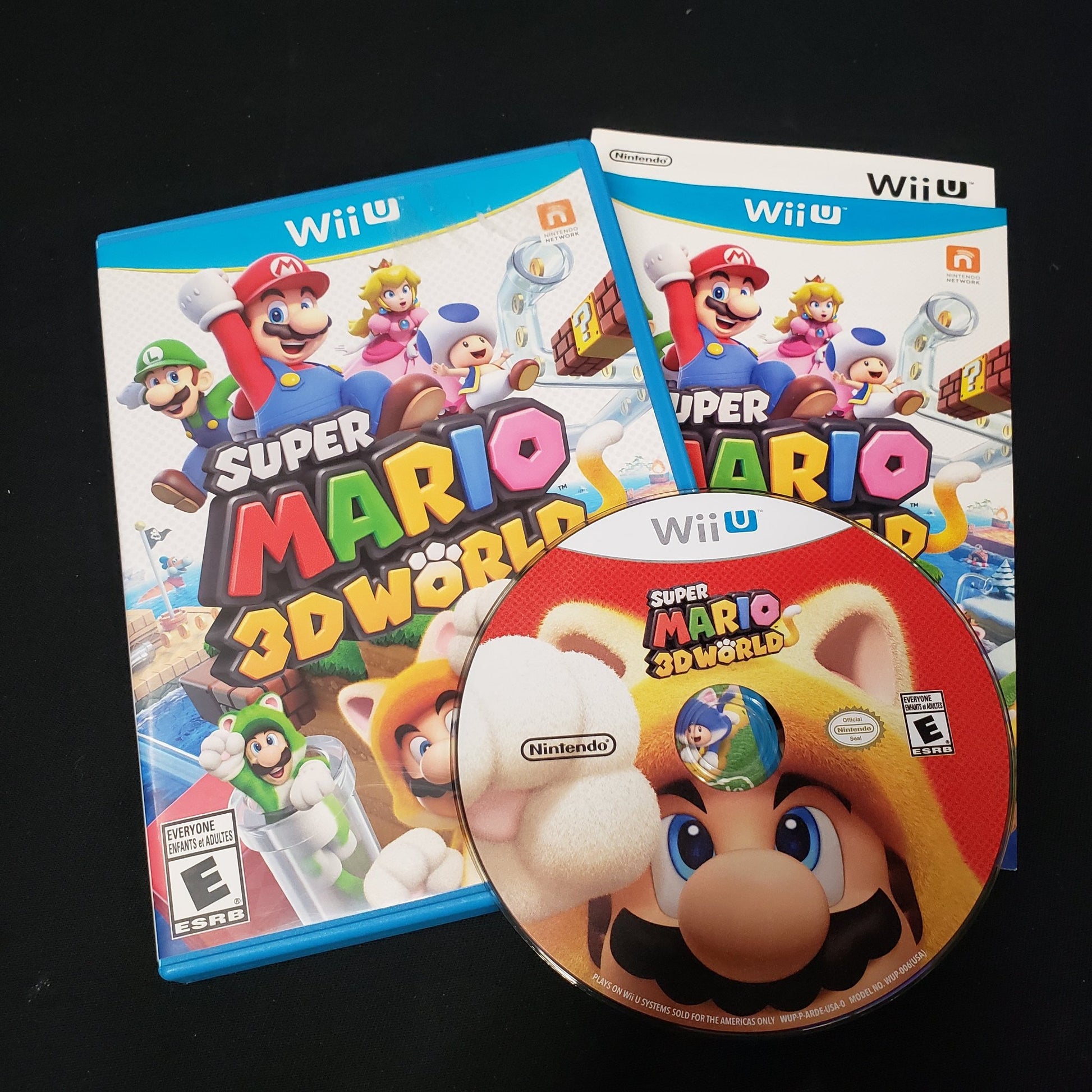 Image shows the case, manual & disc for the video game Super Mario 3D World for Nintendo Wii U