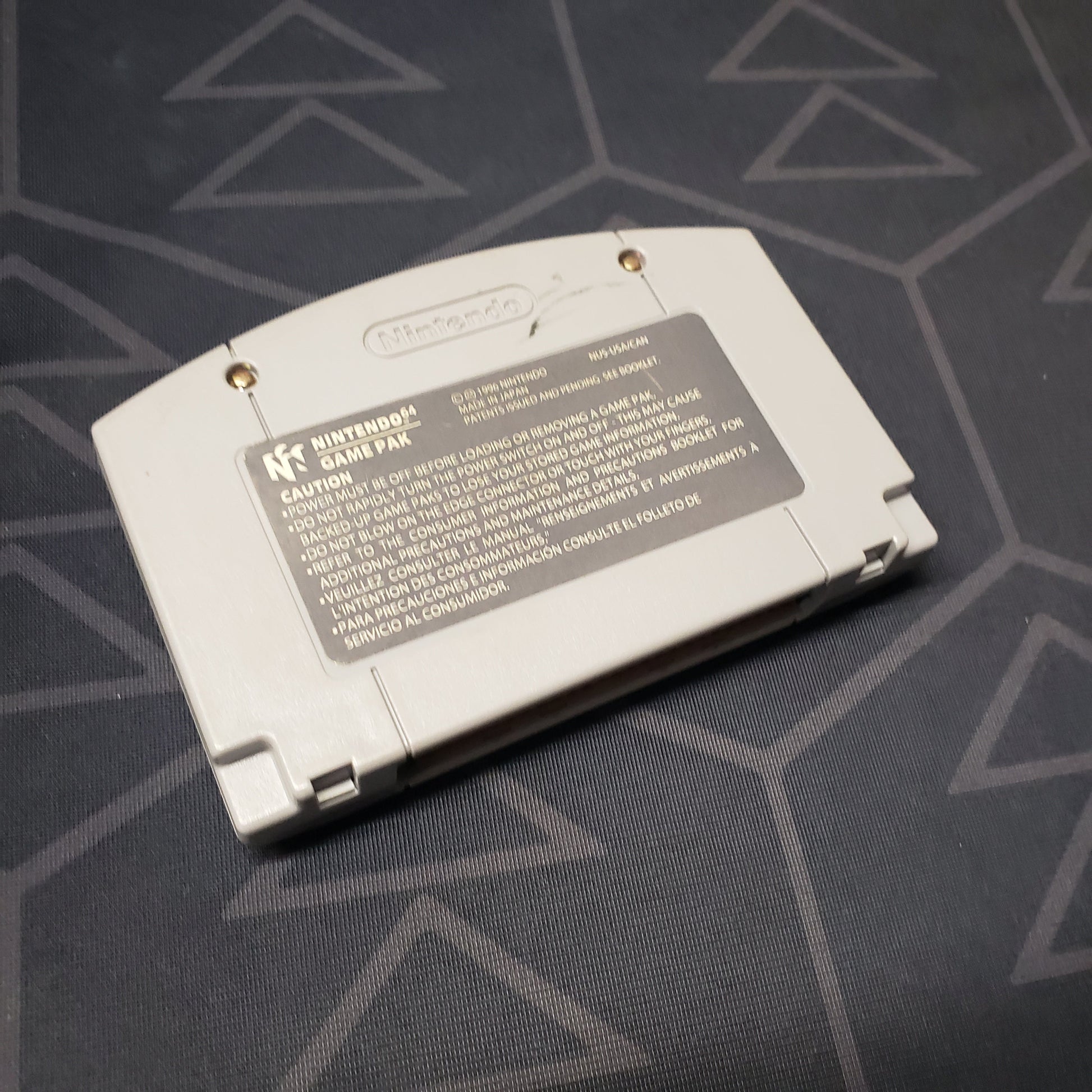 Image shows the back of the cartridge for the video game Super Mario 64 for the Nintendo 64
