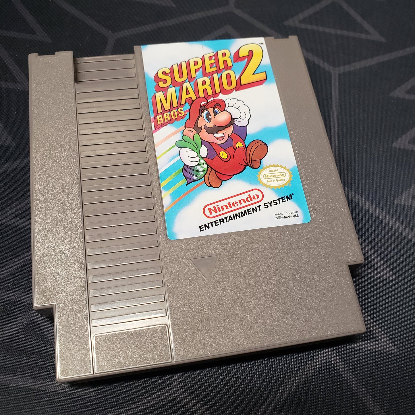 Image shows the front of the cartridge for the video game Super Mario Bros. 2 for the Nintendo Entertainment System
