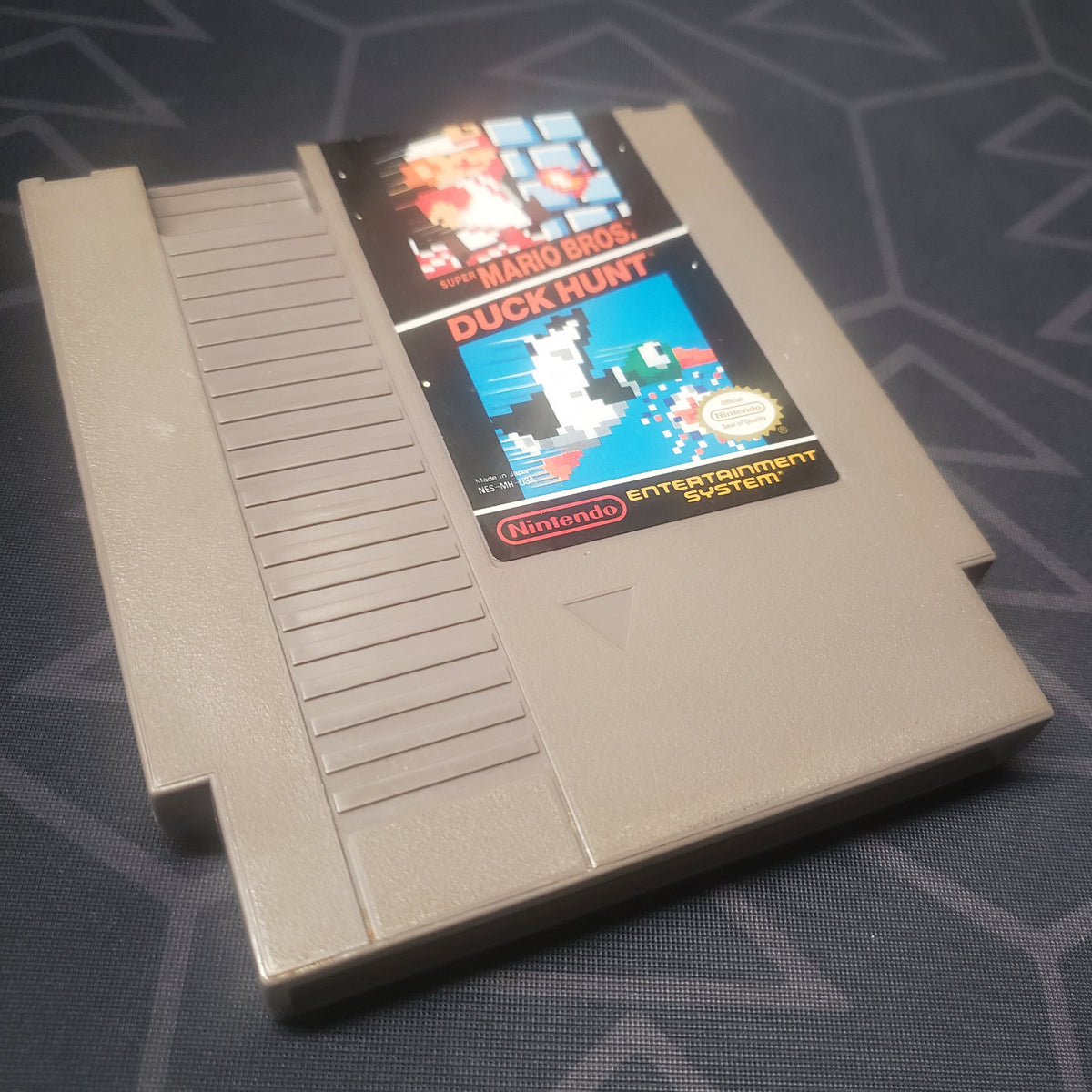 Image shows the front of the cartridge for the video game Super Mario Bros / Duck Hunt for the Nintendo Entertainment System