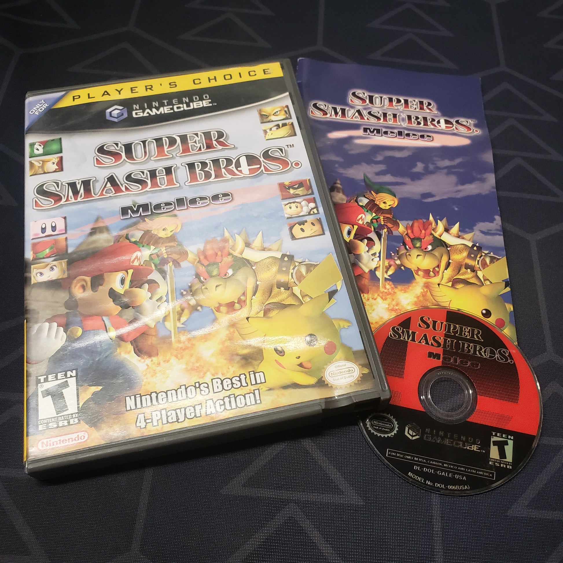 Image shows the case, manual and disc for the video game Super Smash Bros. Melee for Nintendo GameCube