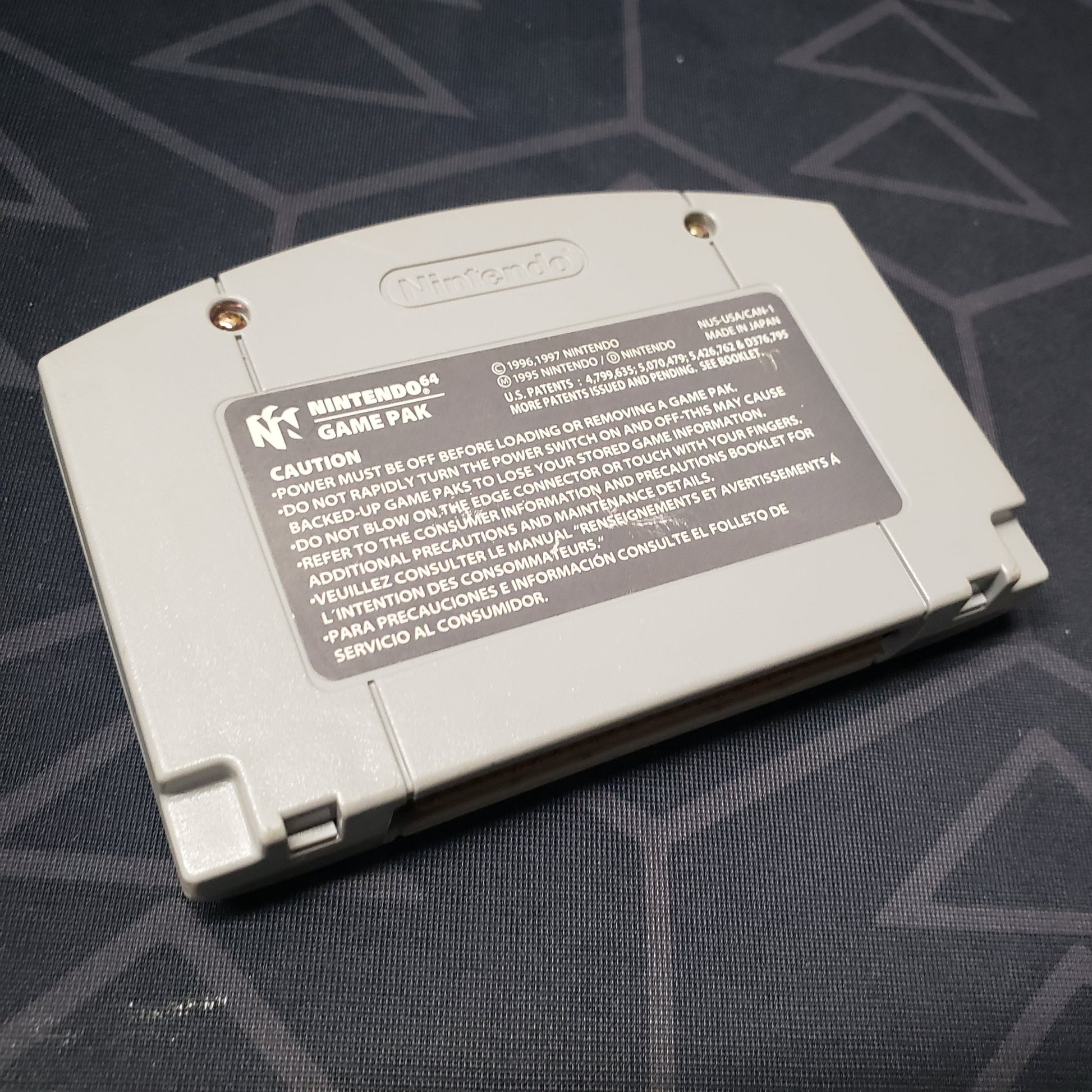 Image shows the backof the cartridge for the video game Super Smash Bros. for the Nintendo 64