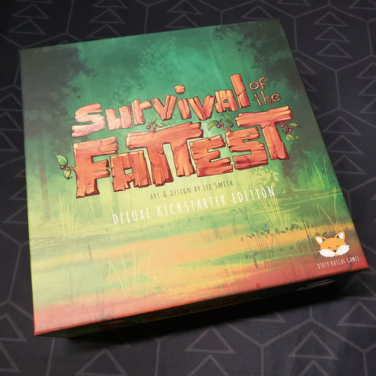 Image shows the front cover of the Deluxe Kickstarter Edition box for the board game Survival of the Fattest