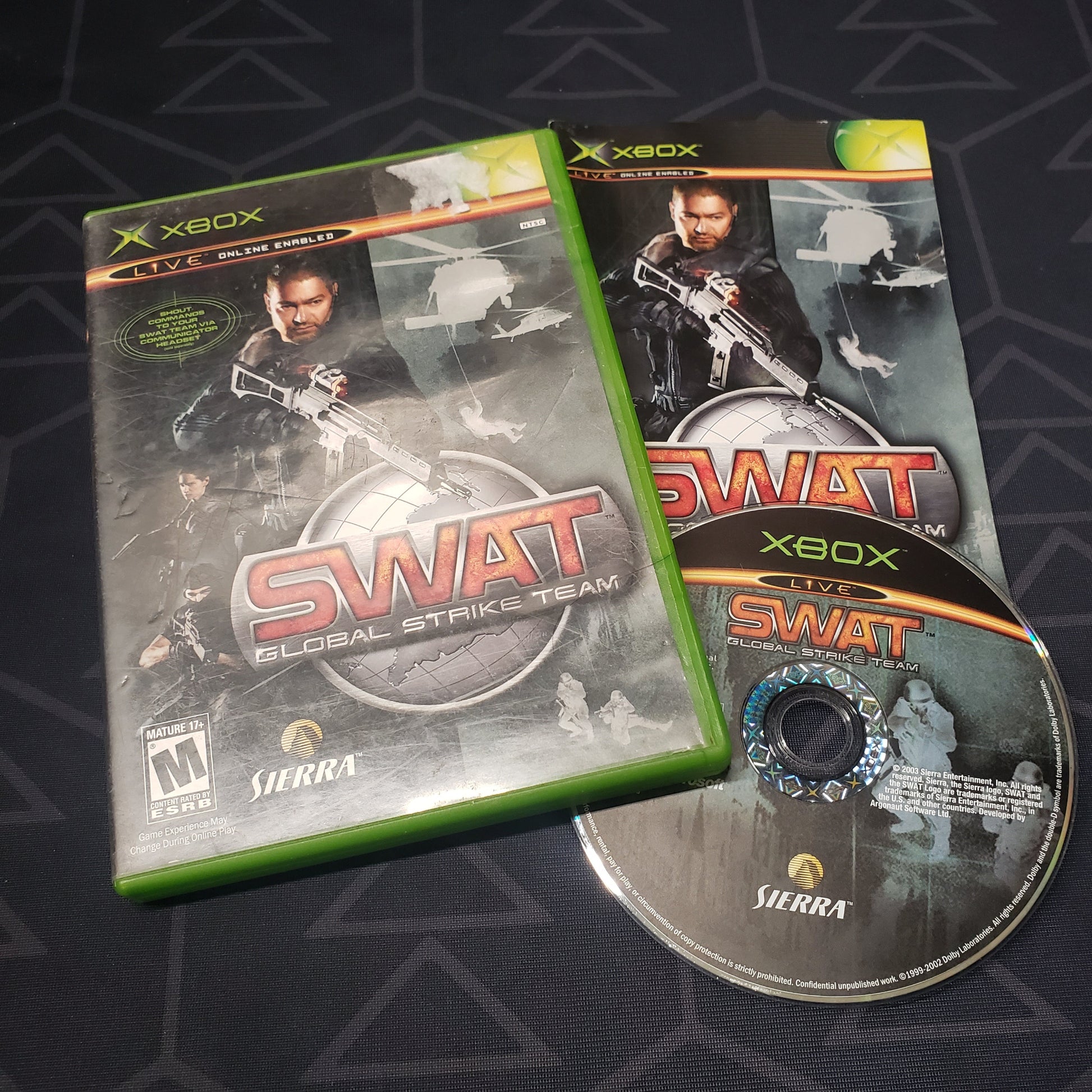 Image shows the case, manual and disc for the video game SWAT: Global Strike Team for the original Xbox
