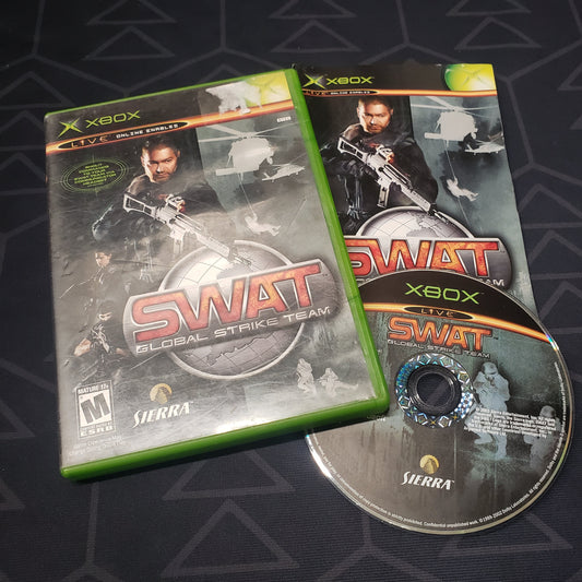 Image shows the case, manual and disc for the video game SWAT: Global Strike Team for the original Xbox