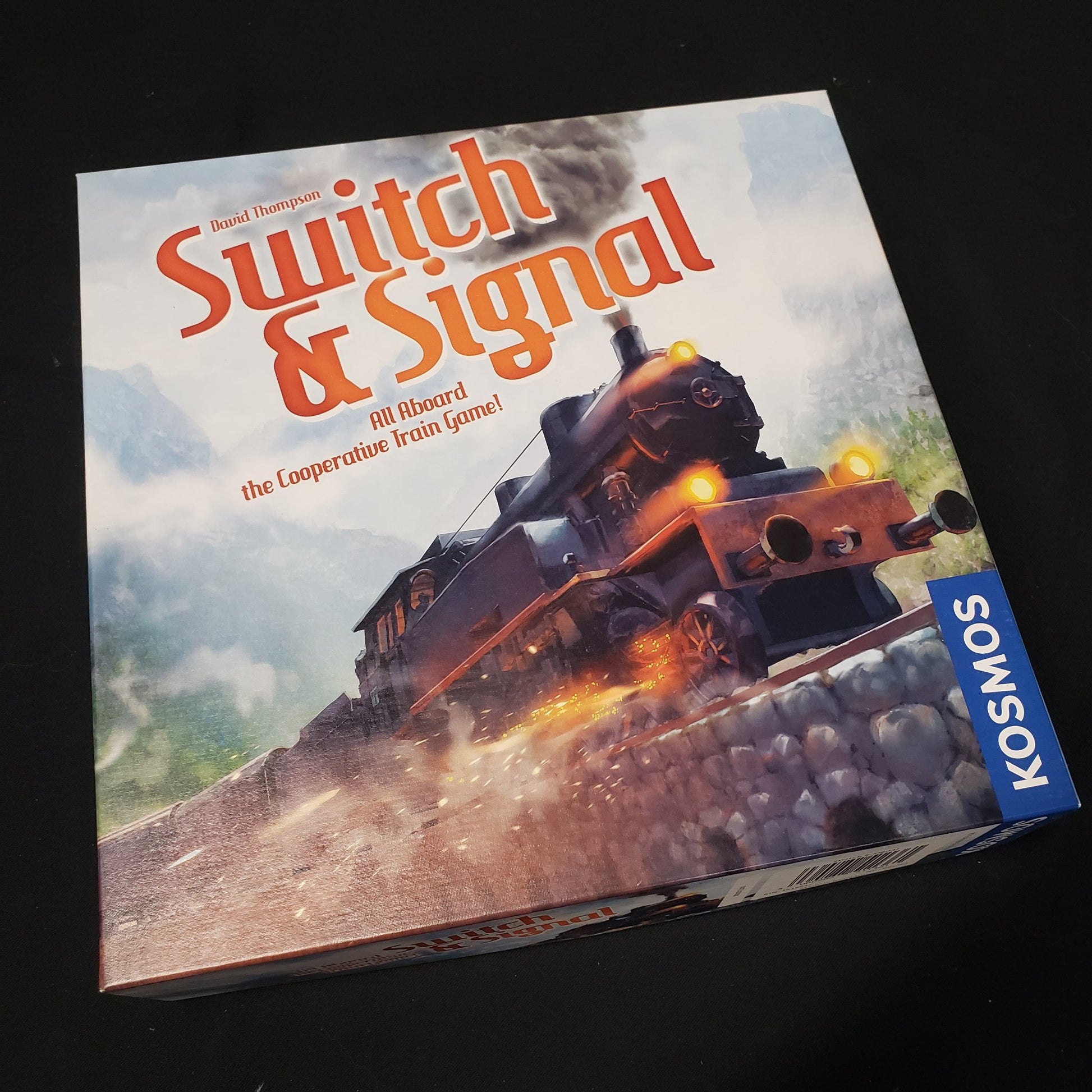 Image shows the front cover of the box of the Switch & Signal board game