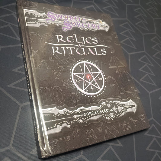 Image shows the front cover of the Sword & Sorcery: Relics and Rituals roleplaying game book