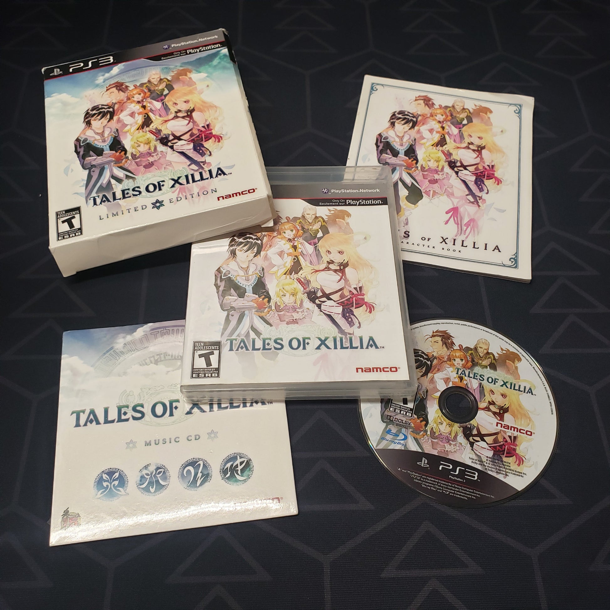 Image shows the case, manual, outer box, soundtrack music CD and game disc for the video game Tales of Xillia: Limited Edition for Playstation 3