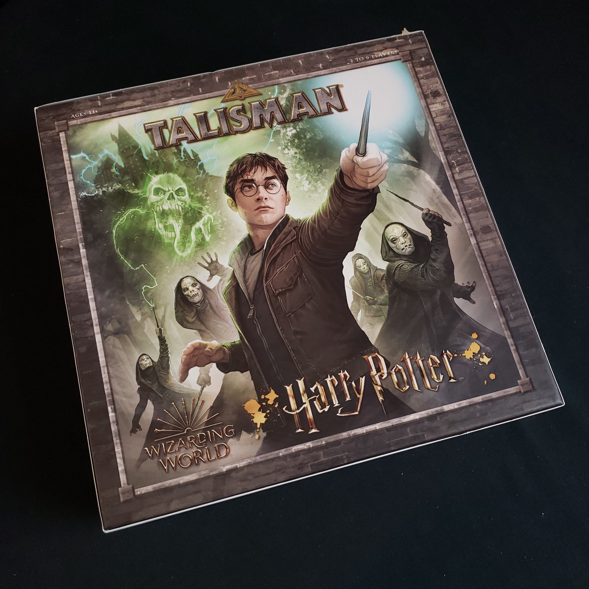 Image shows the front cover of the box of the Talisman: Harry Potter board game