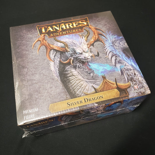 Image shows the front cover of the box of the Silver Dragon expansion for the board game Tanares Adventures