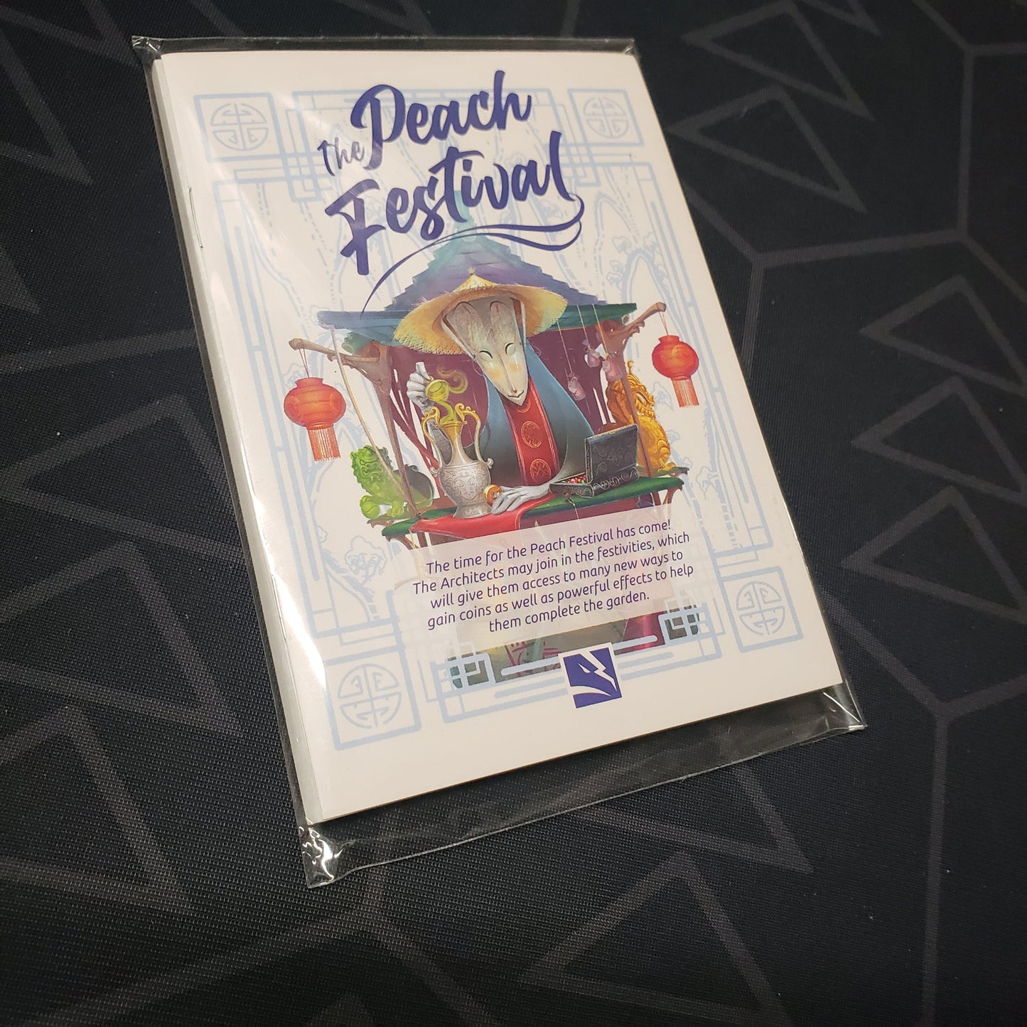 Image shows the front of the packaging for the Peach Festival Scenario expansion for the board game Tang Garden