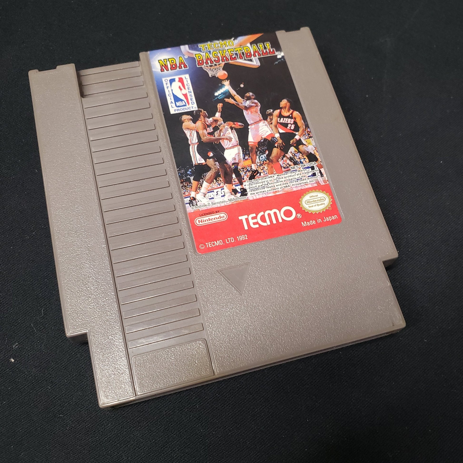 Image shows the front of the cartridge for the video game Tecmo NBA Basketball for the Nintendo Entertainment System