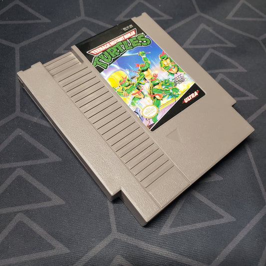 Image shows the front of the cartridge for the video game Teenage Mutant Ninja Turtles for the Nintendo Entertainment System
