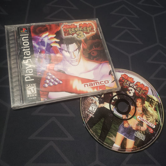 Image shows the jewel case with manual and disc for the video game Tekken 3 for Playstation 1