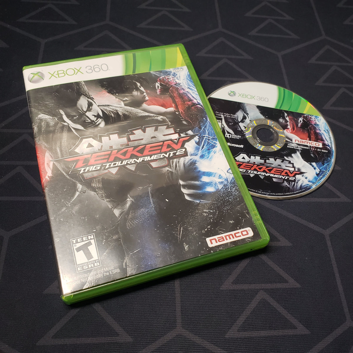 Image shows the case and disc for the video game Tekken Tag Tournament 2 for Xbox 360