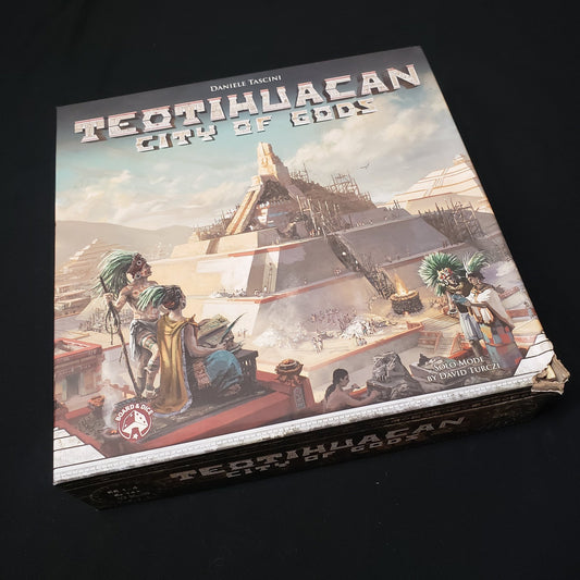 Image shows the front cover of the box of the board game Teotihuacan: City of Gods