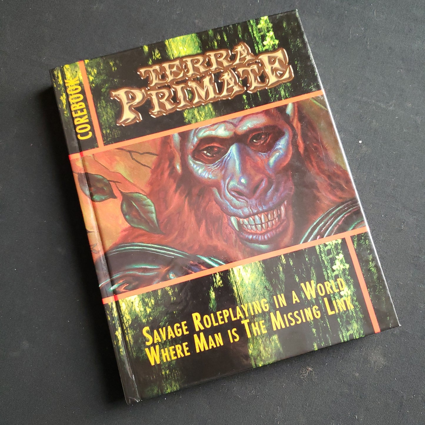 Image shows the front cover of the Core Rulebook for the Terra Primate roleplaying game