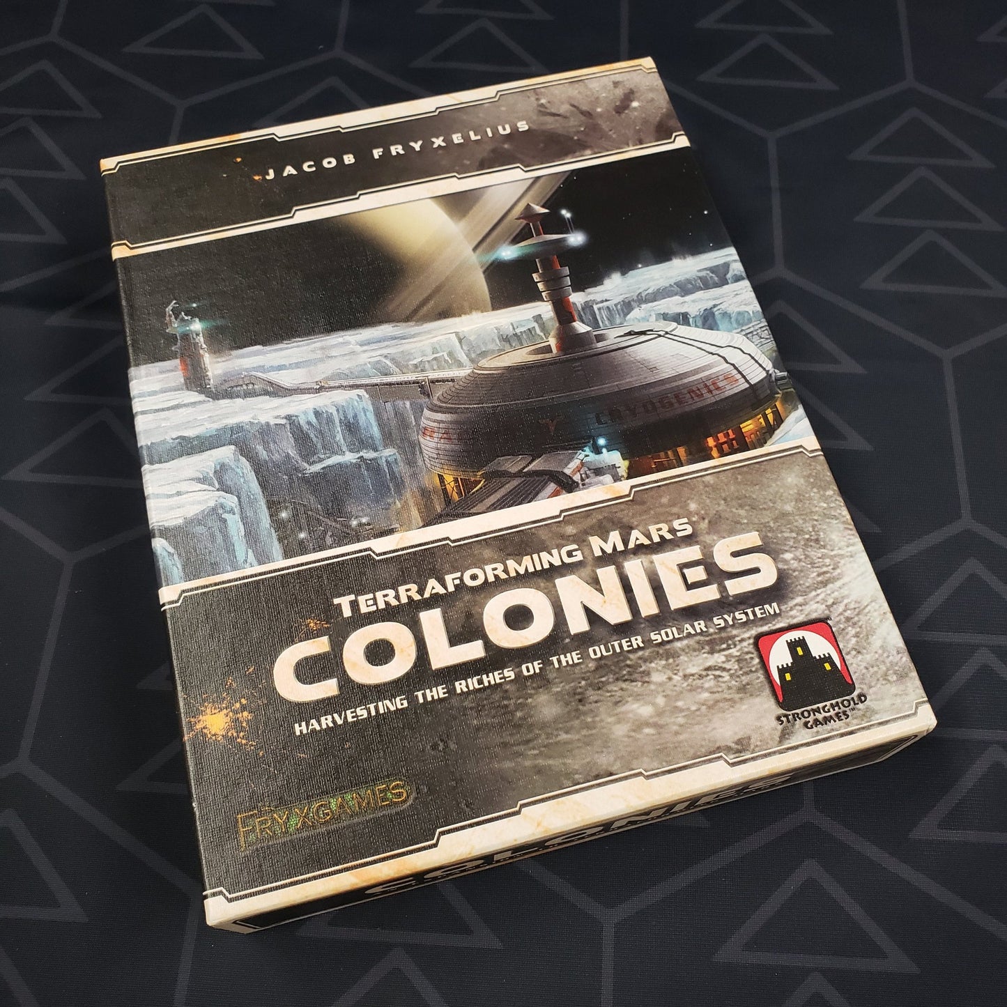 Image shows the front cover of the box of the Colonies expansion for the board game Terraforming Mars