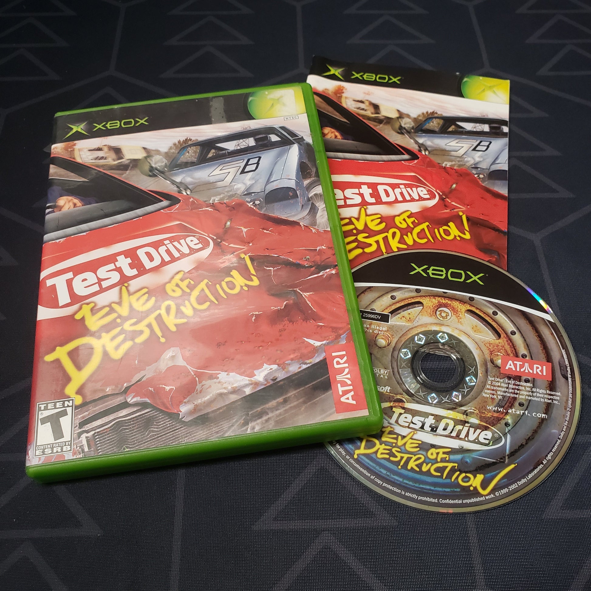Image shows the case, manual and disc for the video game Test Drive: Eve of Destruction for the original Xbox