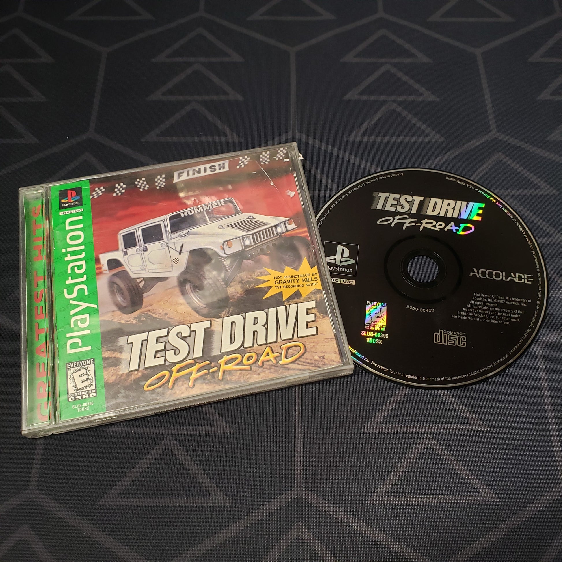 Image shows the jewel case with manual and disc for the video game Test Drive: Off-Road for Playstation 1