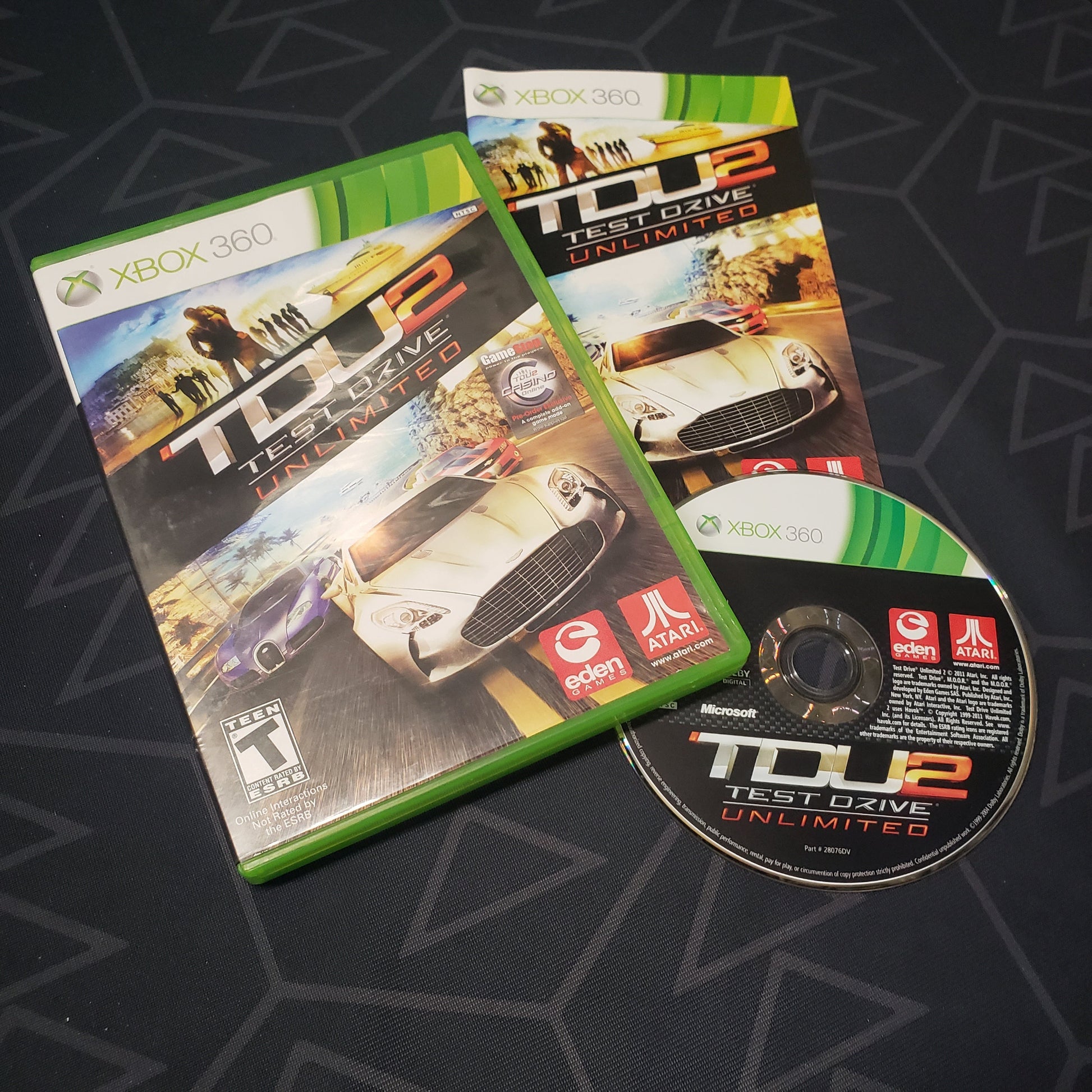 Image shows the case, manual and disc for the video game Test Drive Unlimited 2 for Xbox 360
