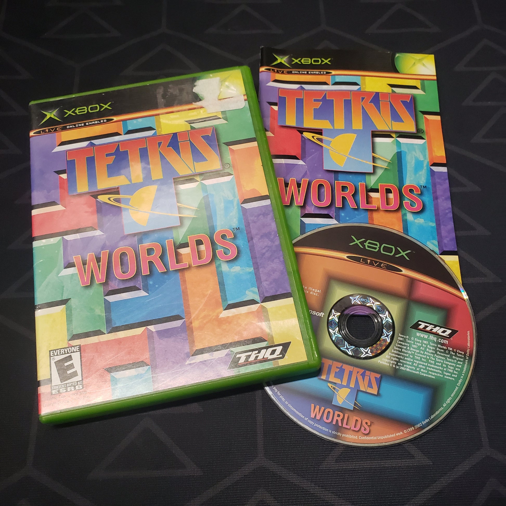 Image shows the case, manual and disc for the video game Tetris Worlds for the original Xbox