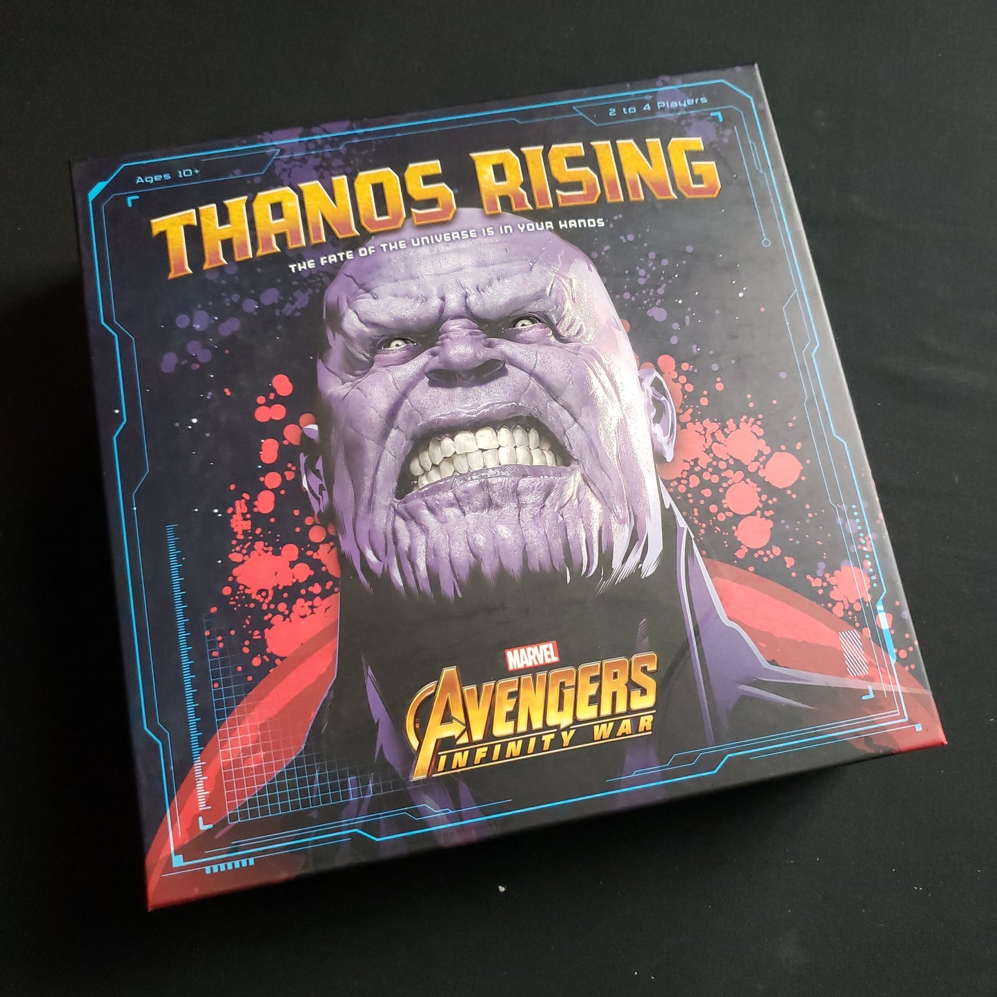 Image shows the front cover of the box of the Thanos Rising board game