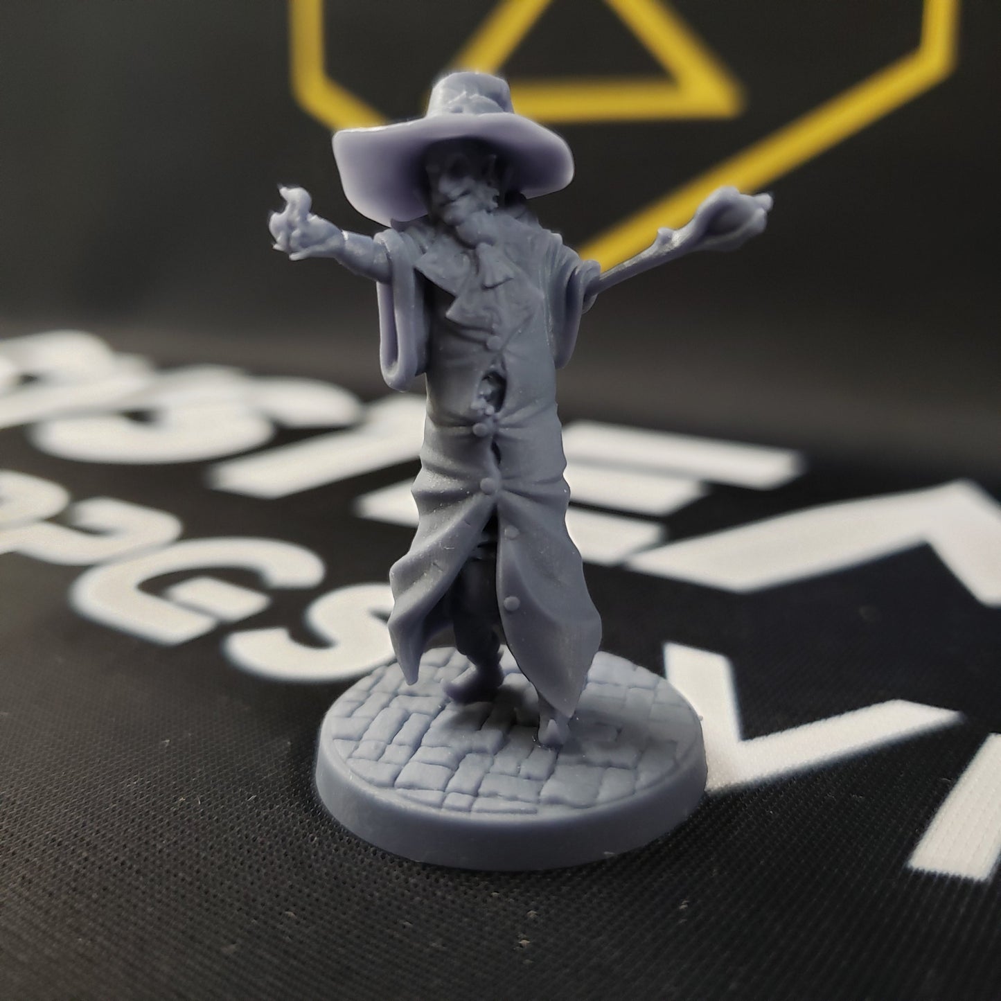 Image shows the front of a gaming miniature of a wizard that is three gnomes in a trenchcoat