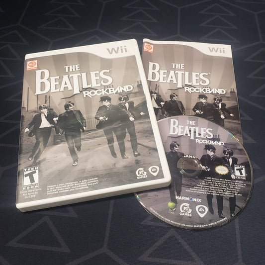 Image shows the case, manual & disc for the video game The Beatles: Rock Band for Nintendo Wii