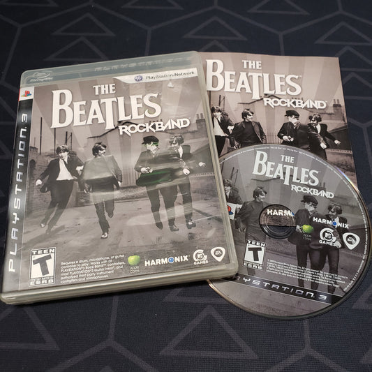 Image shows the case, manual & disc for the video game The Beatles: Rock Band for Playstation 3