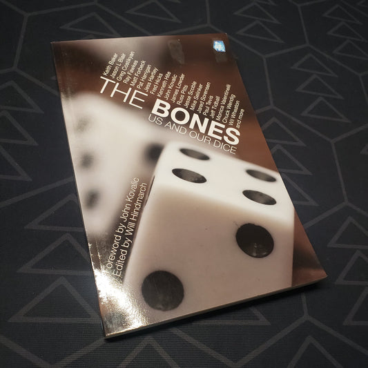 Image shows the front cover of the game essay book The Bones: Us and Our Dice