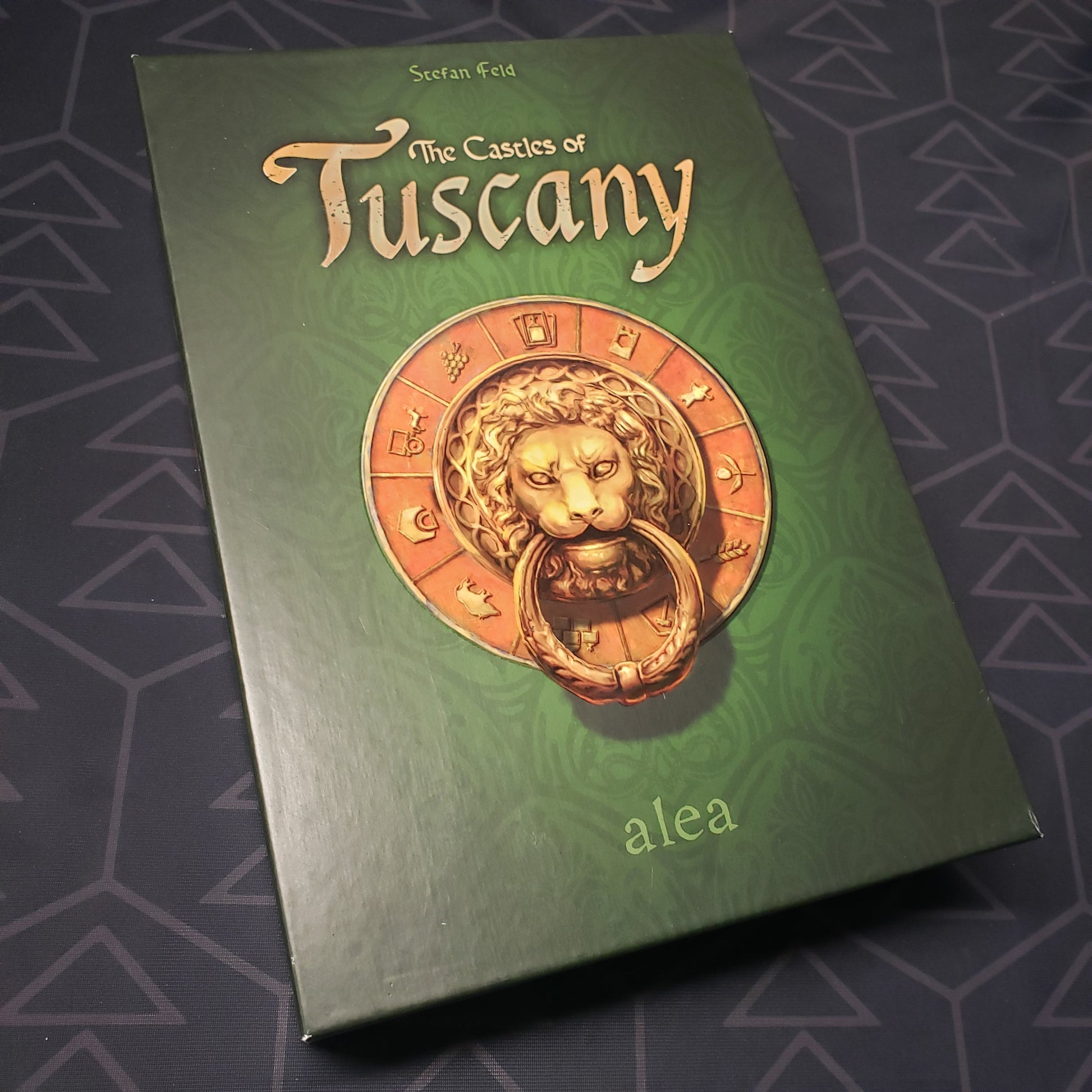 Image shows the front cover of the box for the board game The Castles of Tuscany