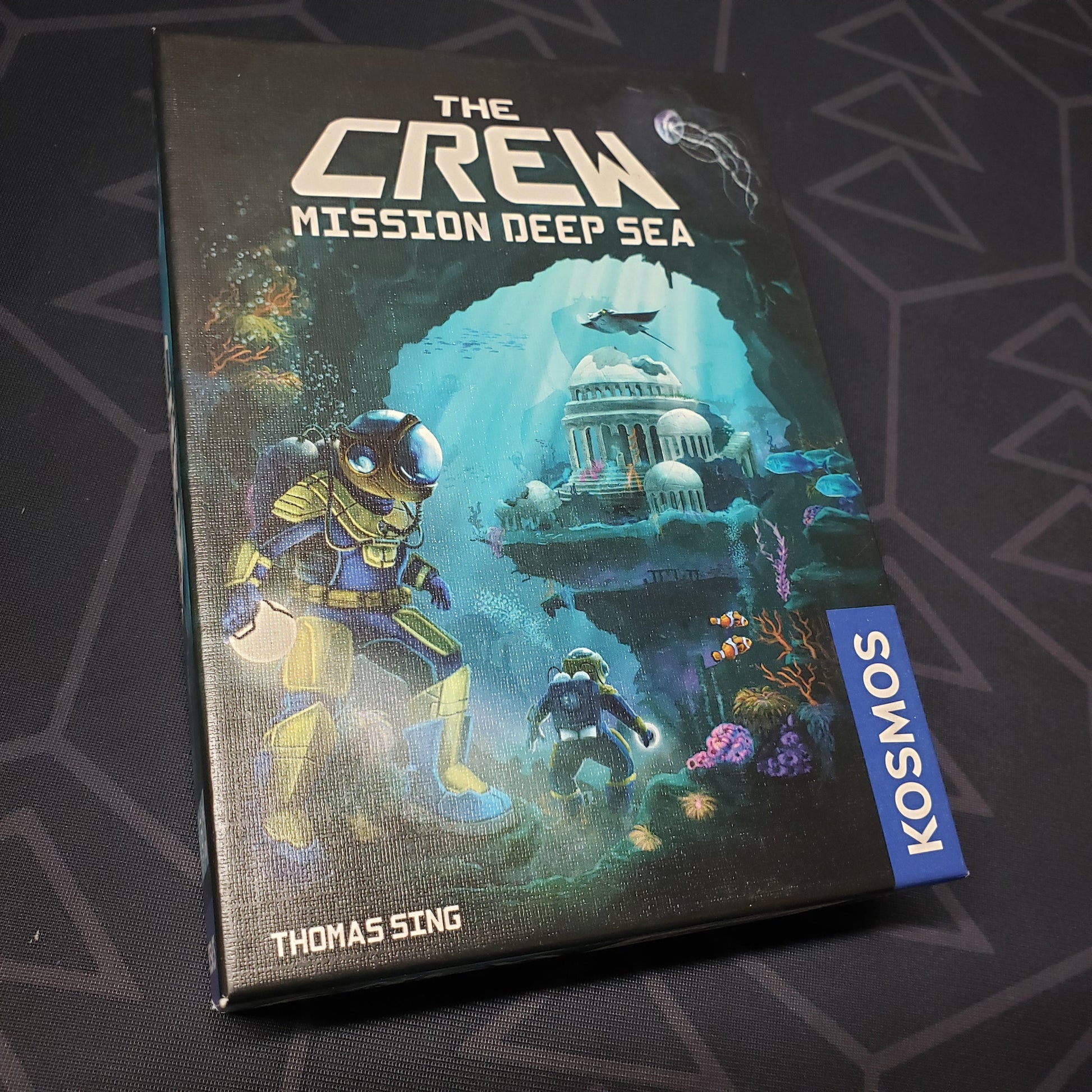 Image shows the front cover of the box for the card game The Crew: Mission Deep Sea