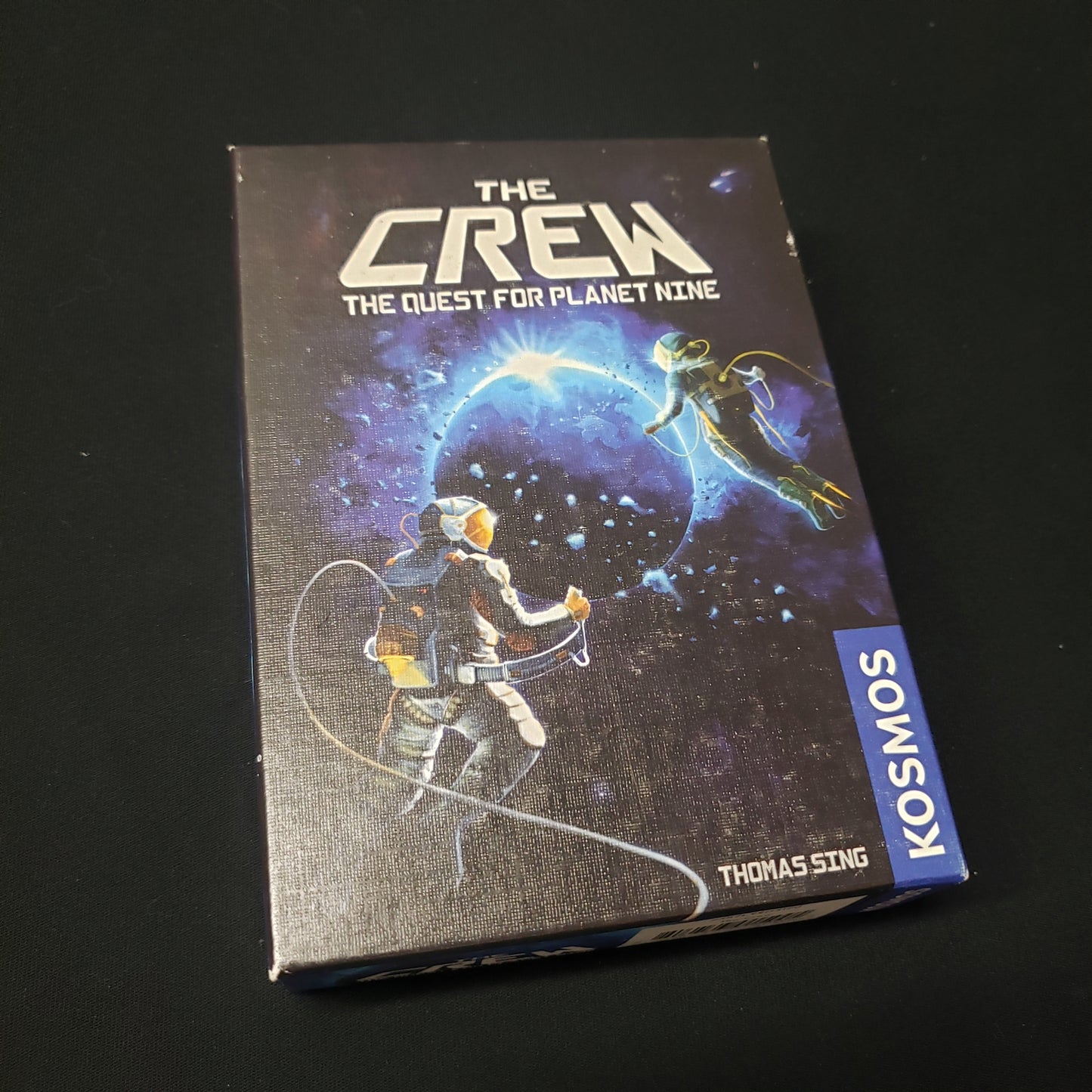 Image shows the front cover of the box of The Crew: The Quest for Planet Nine card game