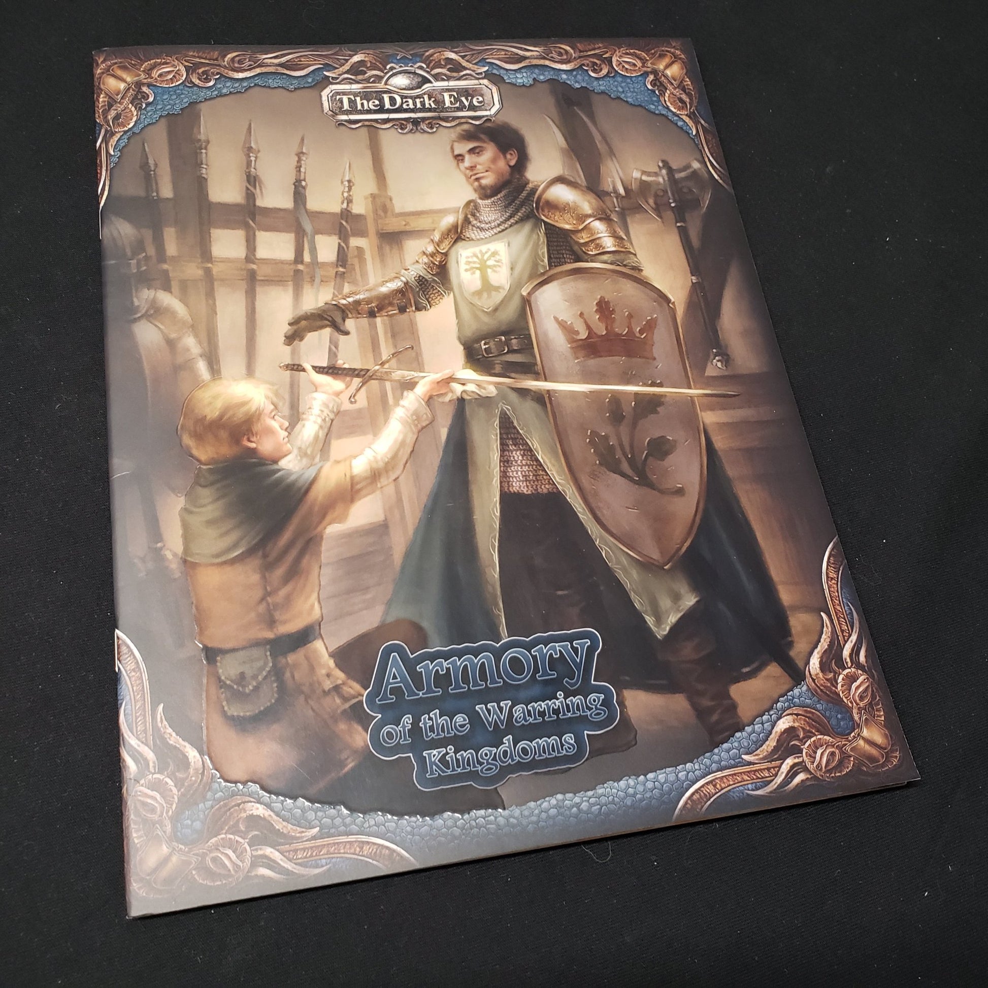 Image shows the front cover of the Armory of the Warring Kingdoms book for the roleplaying game The Dark Eye