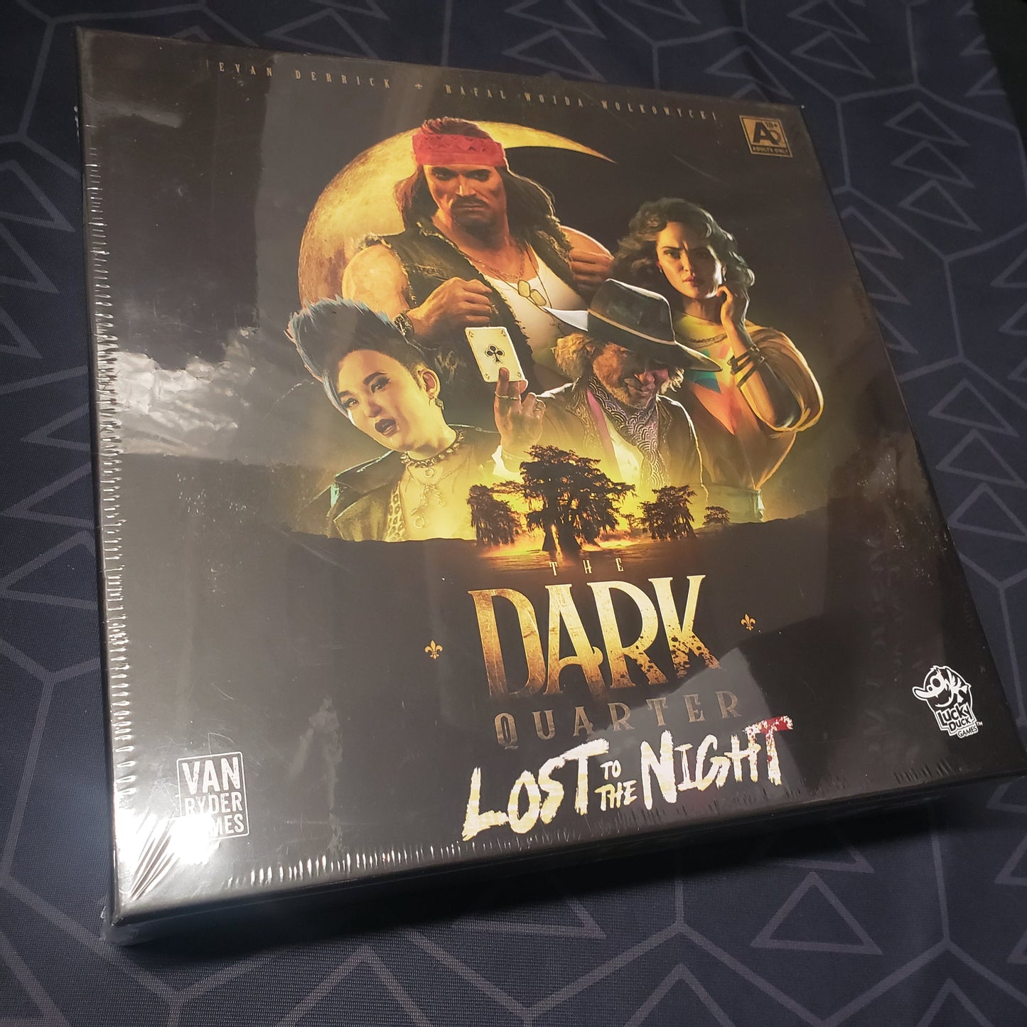 Image shows the front cover of the box of the Lost to the Night expansion for the board game The Dark Quarter