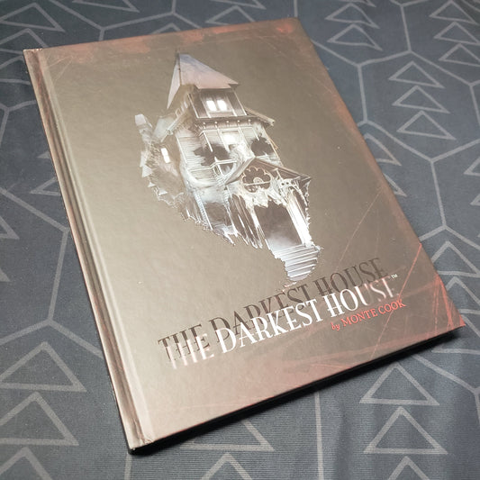 Image shows the front cover of The Darkest House roleplaying game book