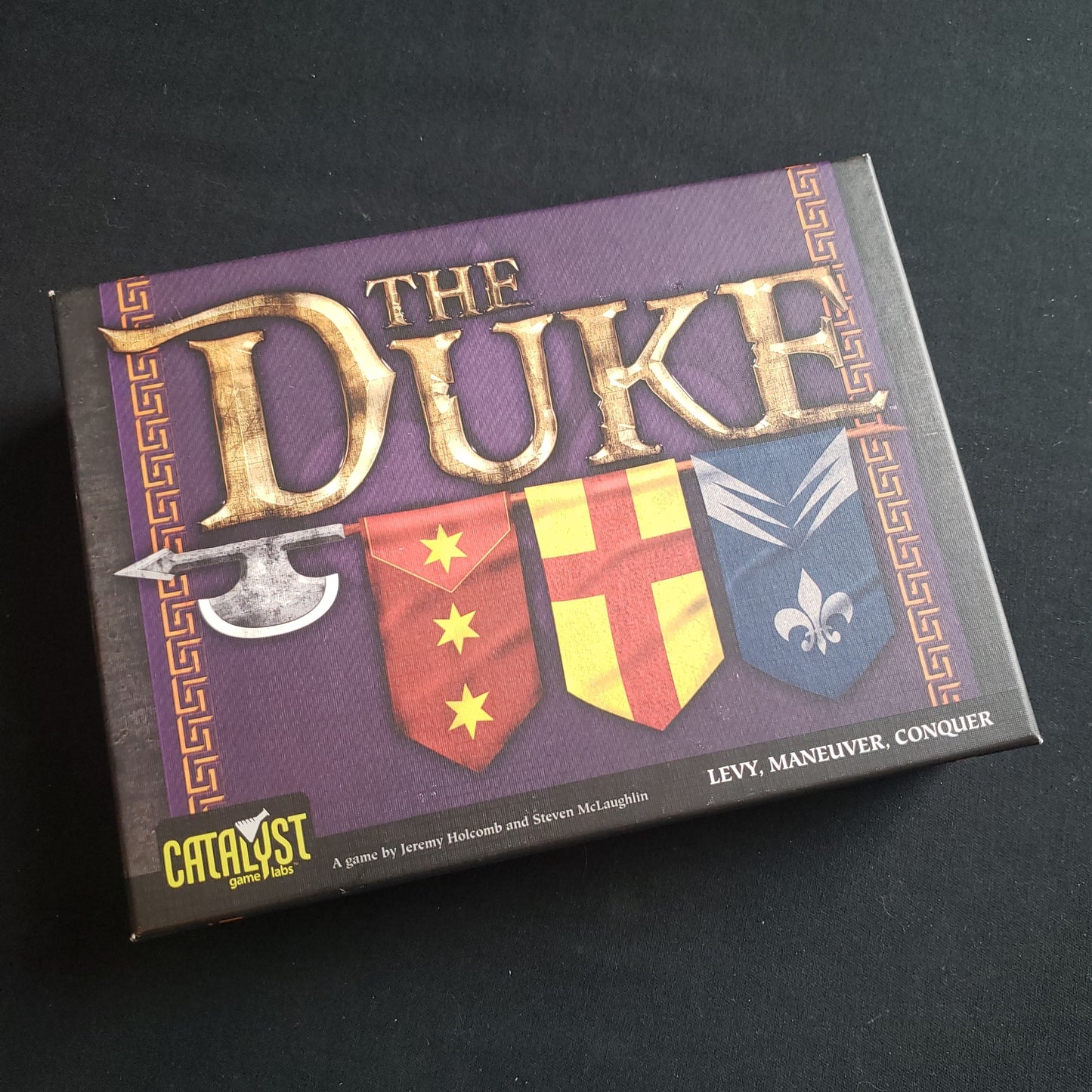Image shows the front cover of the box of the Duke board game