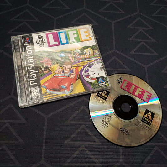 Image shows the jewel case with manual and disc for the video game The Game of Life for Playstation 1