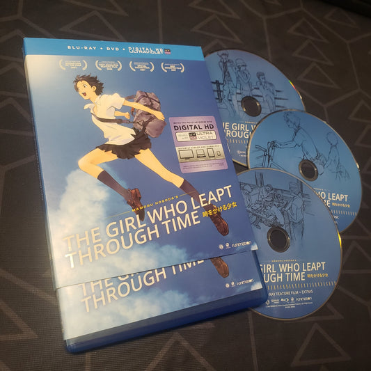 Image shows the case with sleeve & three discs for the movie The Girl Who Leapt Through Time on Blu-Ray + DVD