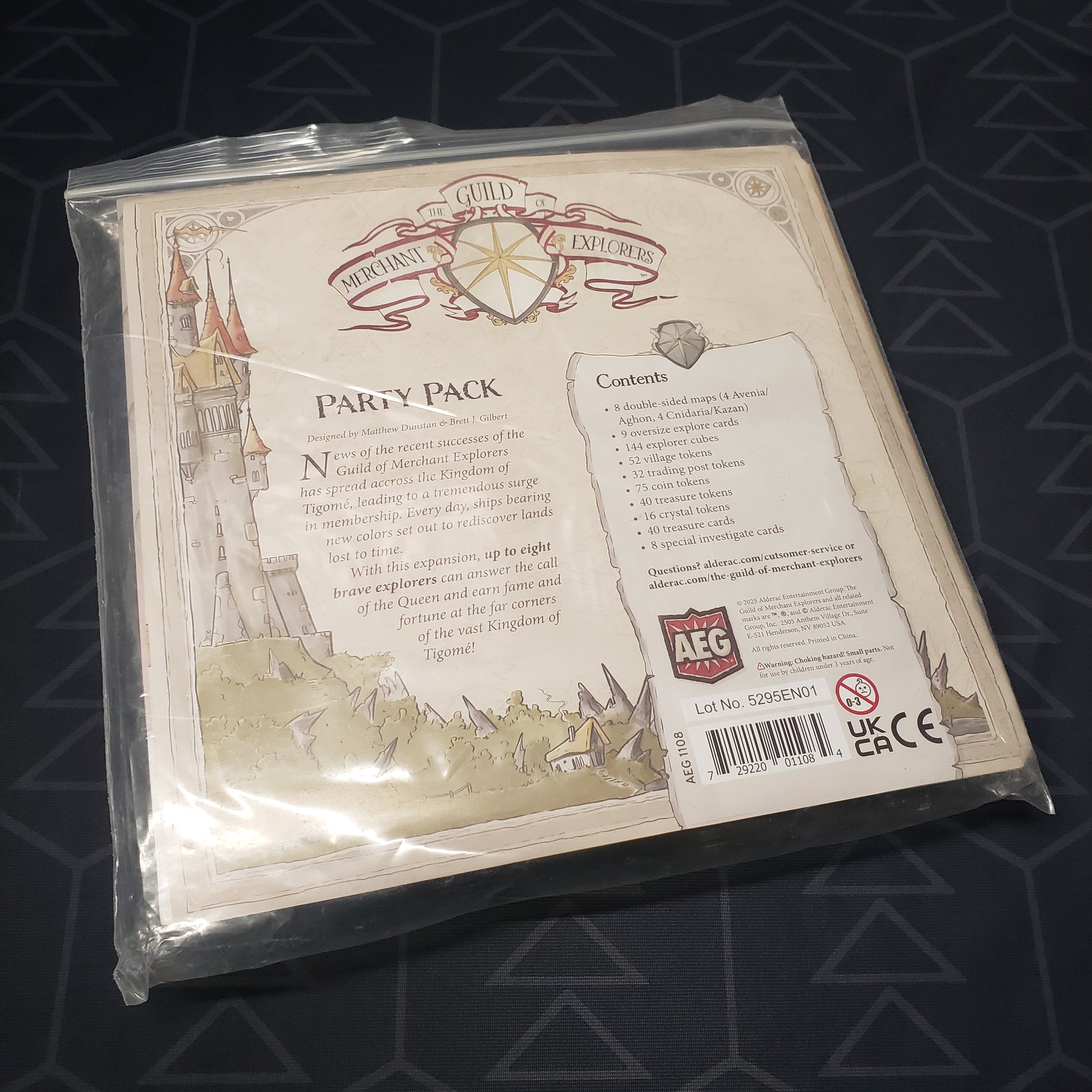 Image shows the bagged instructions insert of the Party Pack expansion for the board game The Guild of Merchant Explorers