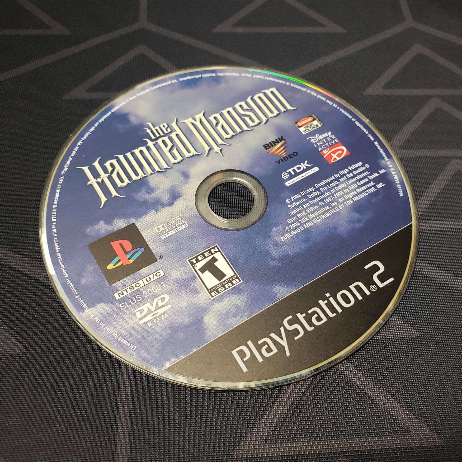 Image shows the label side of the game disc for the video game The Haunted Mansion for Playstation 2