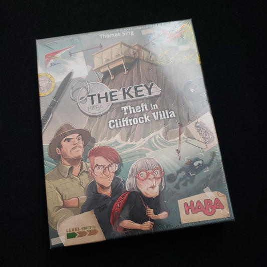 Image shows the front cover of the box of the board game The Key: Theft at Cliffrock Villa