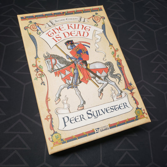 Image shows the front cover of the box for the The King is Dead (Second Edition) board game