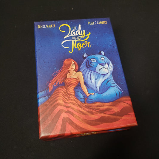 Image shows the front cover of the box of the Lady and the Tiger card game